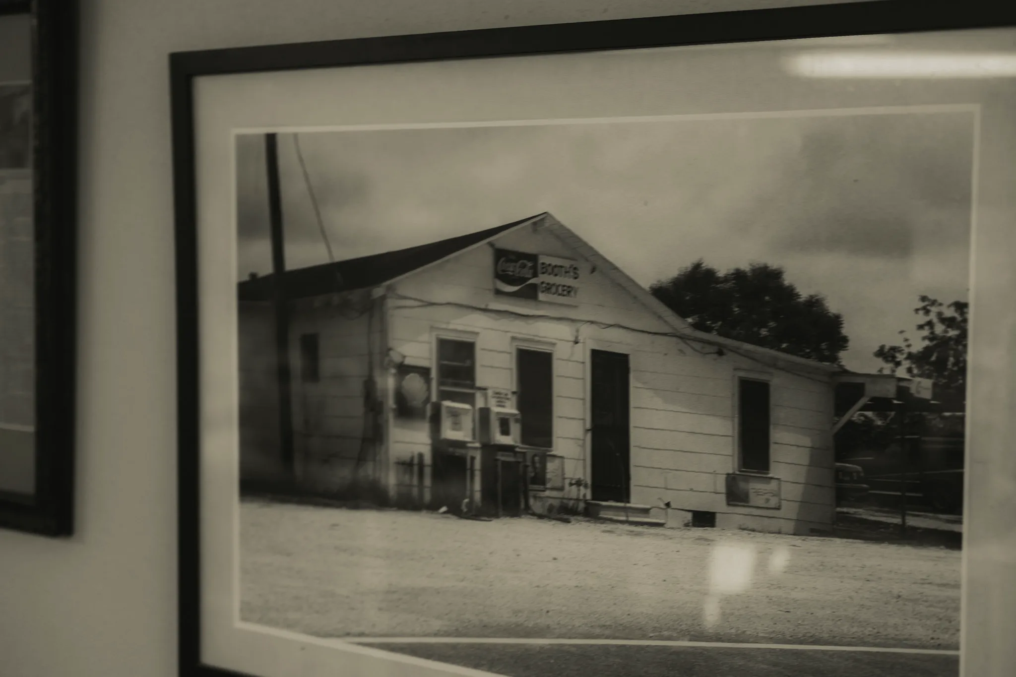 Booth’s Grocery, with its weathered storefront and old fuel pumps