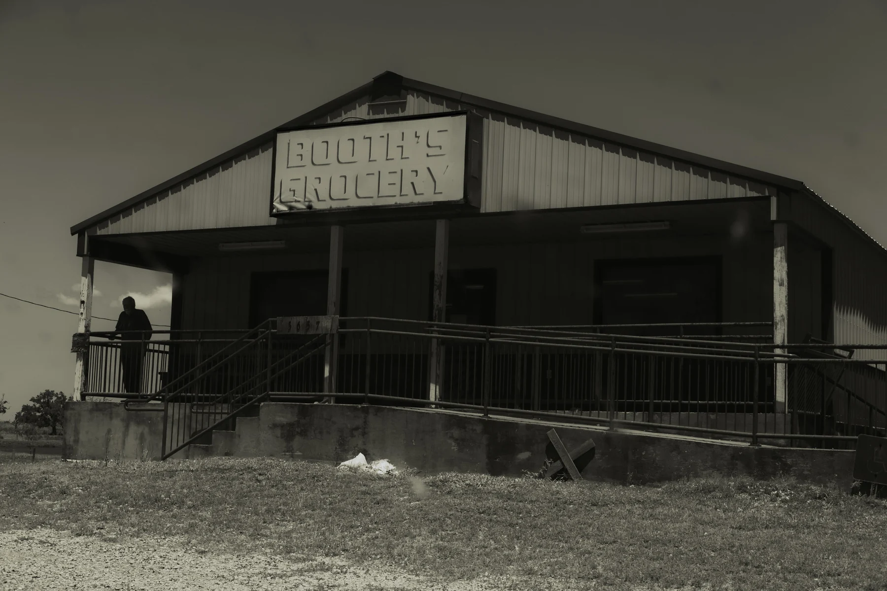 The closed Booth's Grocery storefront in Grand Chenier, Louisiana.